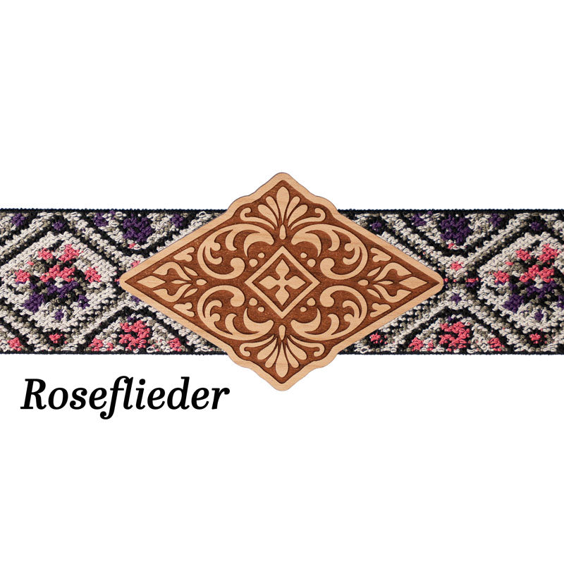 Schürzenschließe mit floralem Musterband