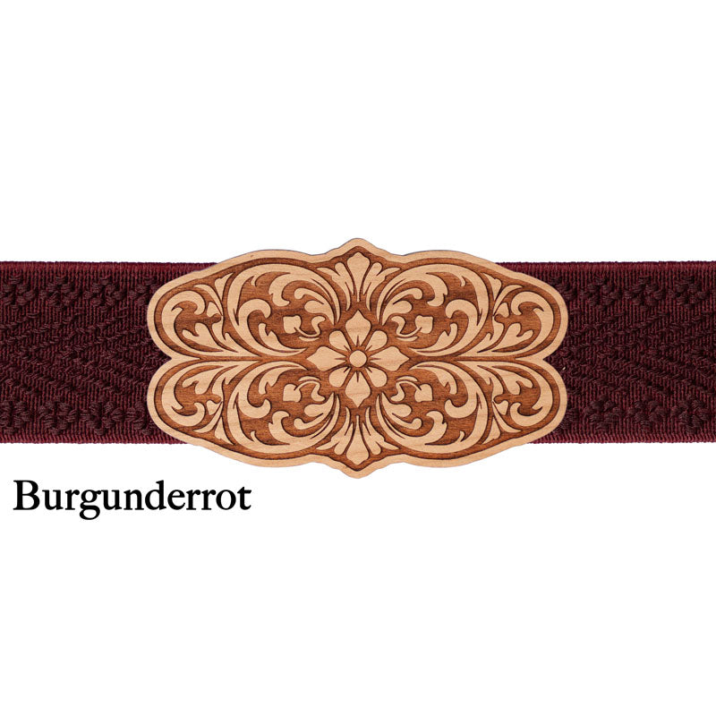 Schürzenschließe aus Holz mit dunkelrotem Band und klassischem Trachtenmuster