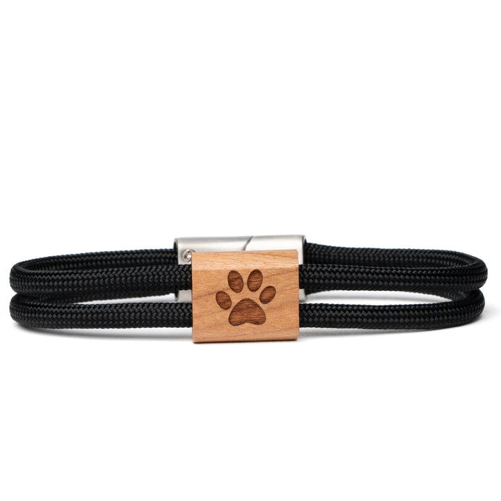 Holzarmband mit Pfotenmotiv und schwarzem Paracord für Tierfreunde
