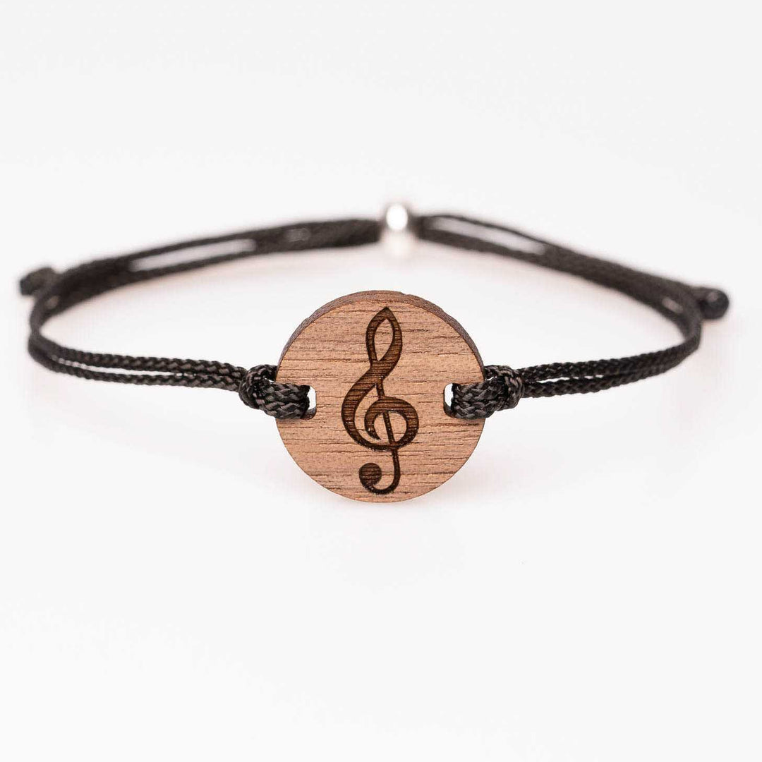 Nussbaum Armband mit eingraviertem Notenschlüssel, schwarzes Nylonband, einzigartiger und personalisierbarer Holzschmuck – besonderes Musikgeschenk für kreative Menschen