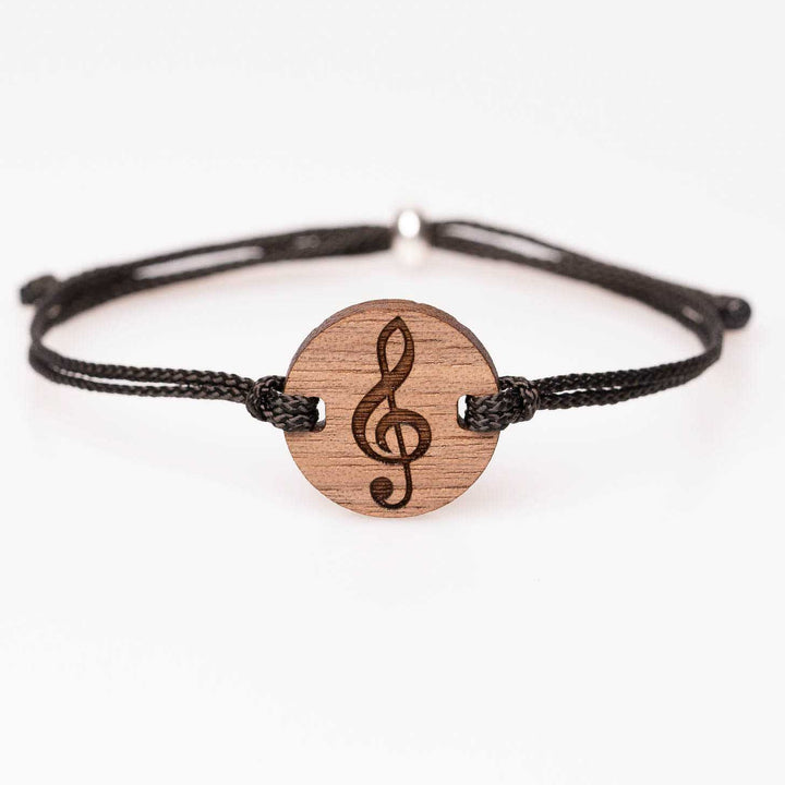Nussbaum Armband mit eingraviertem Notenschlüssel, schwarzes Nylonband, einzigartiger und personalisierbarer Holzschmuck – besonderes Musikgeschenk für kreative Menschen