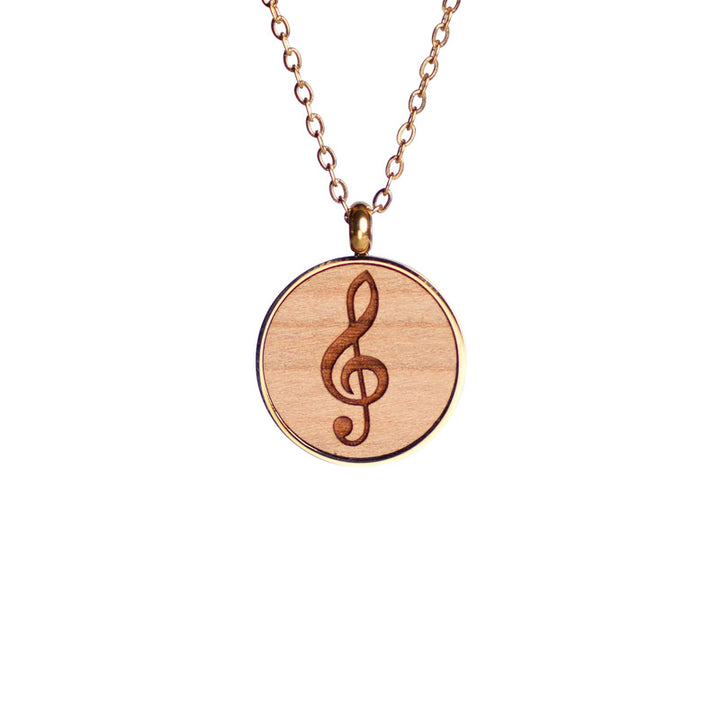 Holzschmuck halskette aus Kirschholz mit Notenschlüssel in einer 18k vergoldeten Edelstahlfassung 